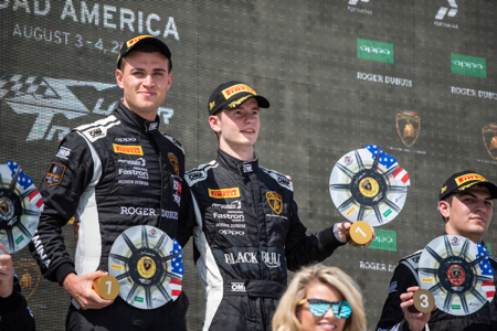 Sandy-Mitchell--Right--on-top-step-of-Road-America-podium-with-Andrea-Amici--copy.jpg